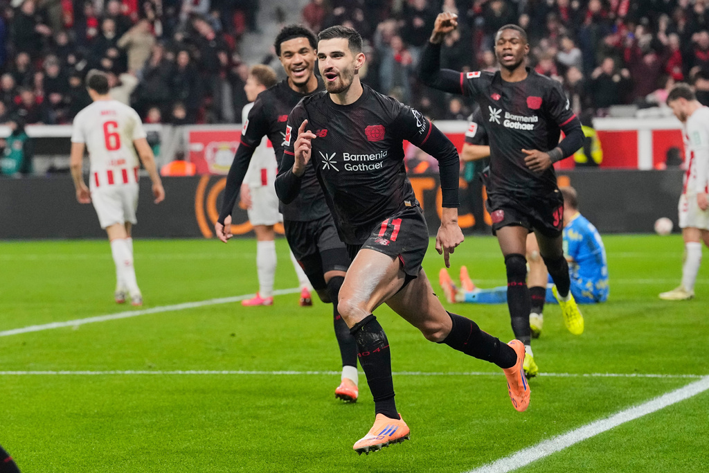 Leverkusen's Martim Terrier celebrates after he scored the opening goal during the German Bundesliga soccer match between Bayer 04 Leverkusen and 1.FC Cologne in Leverkusen, Germany, Saturday, Dec. 13, 2025. (AP Photo/Martin Meissner)