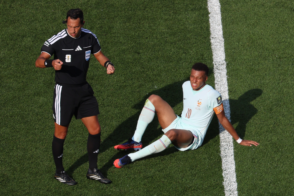 France's Kylian Mbappe (10) sits on the pitch during the World Cup quarterfinal soccer match against Morocco in Foxborough, Mass., near Boston, Thursday, July 9, 2026. (AP Photo/Mark Stockwell)