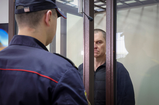 FILE -Journalist Andrzej Poczobut stands in a defendants' cage during a court session in Grodno, Belarus, Jan. 16, 2023. (Leonid Shcheglov/Pool via AP, File) FILE -Journalist Andrzej Poczobut stands in a defendants' cage during a court session in Grodno, Belarus, Jan. 16, 2023. (Leonid Shcheglov/Pool via AP, File)