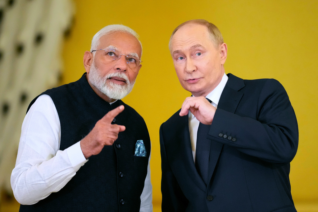 FILE - Russian President Vladimir Putin, right, and Indian Prime Minister Narendra Modi examine a hall prior to the award ceremony of Narendra Modi with the Order of St. Andrew the Apostle the First-Called in the Kremlin in Moscow, Russia, on July 9, 2024. (AP Photo/Alexander Zemlianichenko, File)