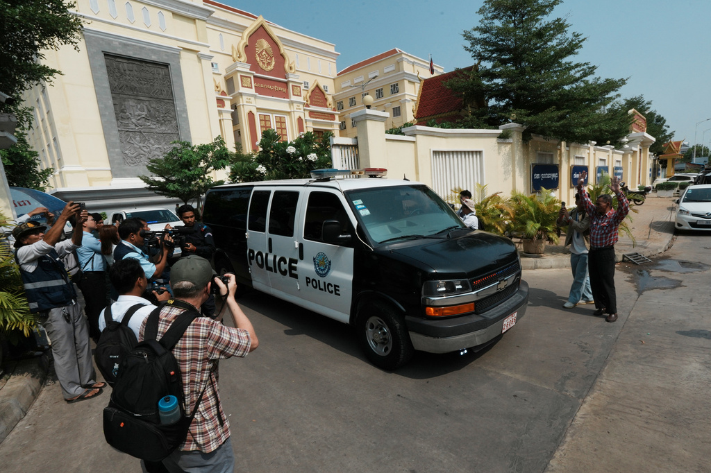 A Cambodian police vehicle which is believed to carry former Cambodia National Rescue Party's President Kem Sokha heads out from an appeals court after a court session in Phnom Penh, Cambodia, Thursday, April 30, 2026. (AP Photo/Heng Sinith)