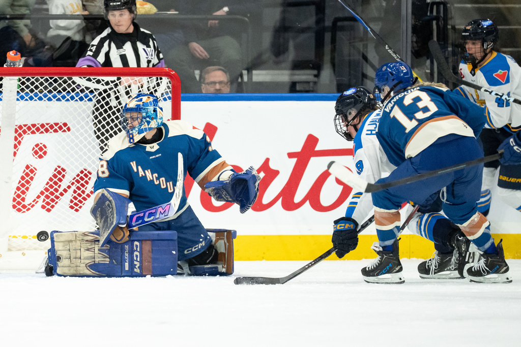 Toronto Sceptres' Sara Hjalmarsson (19) scores on Vancouver Goldeneyes goaltender Emerance Maschmeyer (38) as Tereza Vanisova (13) watches during the first period of an PWHL hockey game in Vancouver, Sunday, March 1, 2026. (Ethan Cairns/The Canadian Press via AP)