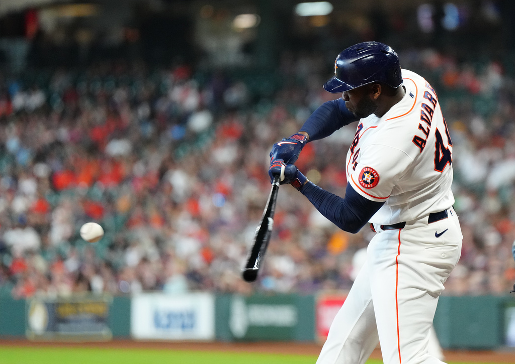 Houston Astros' Yordan Alvarez hits a double off Milwaukee Brewers starting pitcher Brandon Sproat during the first inning of a baseball game, Saturday, May 30, 2026, in Houston. (AP Photo/Karen Warren)