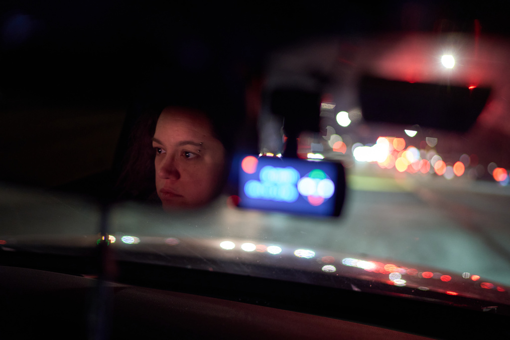 Jean Booth, who was targeted in a romance scam, drives through Lakewood, Ohio, Dec. 9, 2025. (AP Photo/David Goldman)