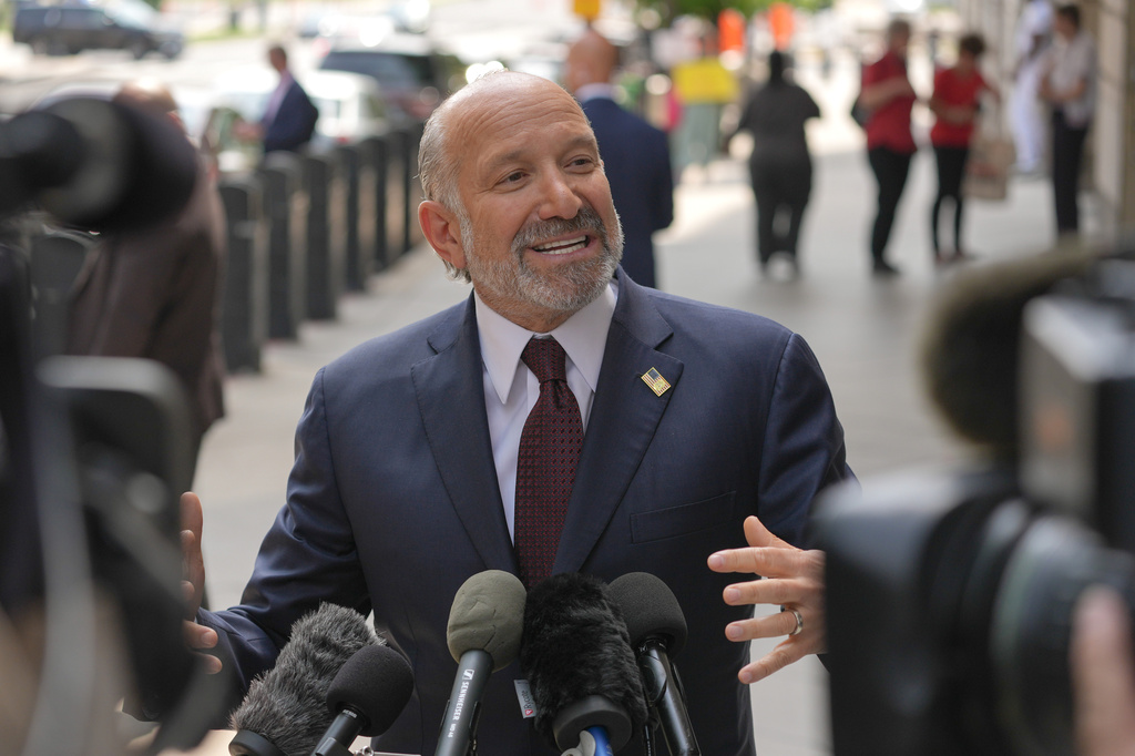 Commerce Secretary Howard Lutnick speaks with reporters outside of the Federal Courthouses before a hearing to allow President Donald Trump's name to be on the Kennedy Center, Thursday, Aug. 27, 2026, in Washington. (AP Photo/Mariam Zuhaib)