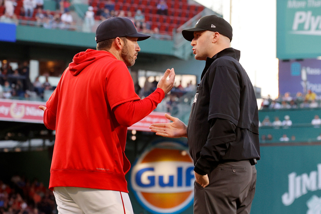 Boston Red Sox interim manager Chad Tracy, left, argues with umpire Nic Lentz, right, after Lentz ejected Red Sox's Willson Contreras for contesting a call during the second inning of a baseball game against the Washington Nationals, Monday, June 29, 2026, in Boston. (AP Photo/Mary Schwalm)