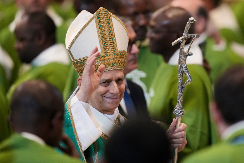 Pope Leo XIV waves to faithful after a special mass for the Jubilee of the poor, in St. Peter's Square at The Vatican, Sunday, Nov.16, 2025. (AP Photo/Gregorio Borgia)