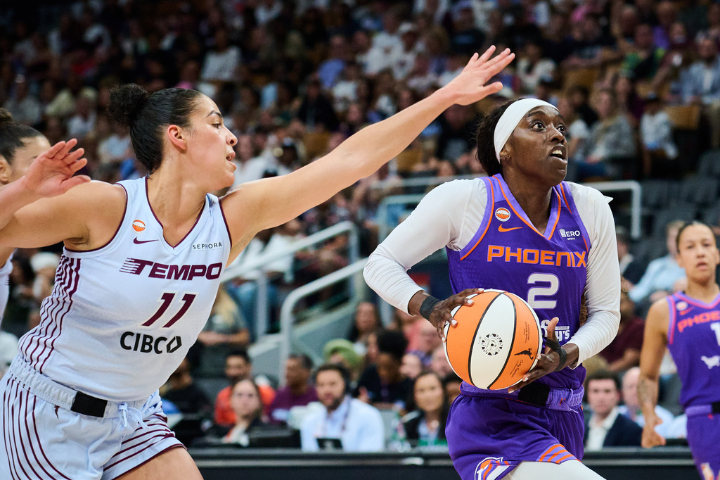 Phoenix Mercury's Kahleah Copper (2) drives to the net past Toronto Tempo's Kia Nurse (11) during first half of an WNBA basketball game in Toronto, on Saturday, June 27, 2026. (Sammy Kogan /The Canadian Press via AP)