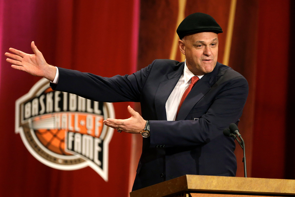 FILE - Inductee Oscar Schmidt, of Brazil, speaks during the enshrinement ceremony for this year's class of the Basketball Hall of Fame, at Symphony Hall in Springfield, Mass., Sept. 8, 2013. Schmidt, whom his Brazil compatriots know as the “Holy Hand,” died. Friday, April 17, 2026. He was 68. (AP Photo/Steven Senne, File)