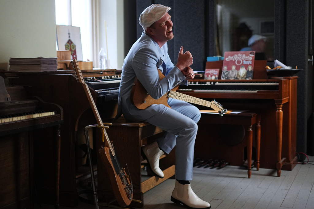 Conrad Fisher laughs during an interview with the Associated Press ahead of his performance at Ragamuffin Hall in McCoysville, Pa., Saturday, April 25, 2026. (AP Photo/Matt Rourke)