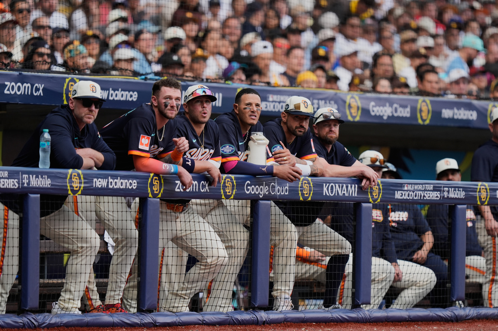 Players of the San Diego Padres stand at the dugout during the eighth inning of a baseball game against the Arizona Diamondbacks in Mexico City, Sunday, April 26, 2026. (AP Photo/Fernando Llano)