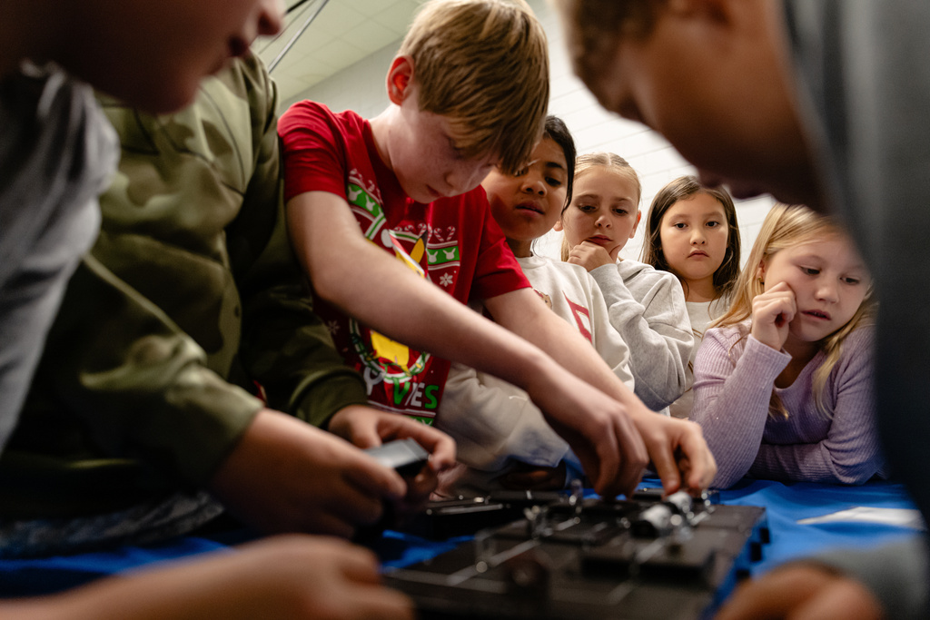 Students work together on a science, technology, engineering and mathematics challenge, facilitated by the Kentucky Science Center, in Simpsonville Elementary School, Nov. 18, 2025, in Simpsonville, Ky. (AP Photo/Jon Cherry)