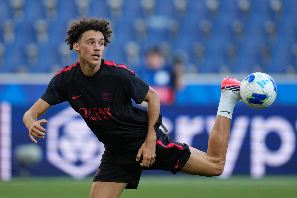 PSG's Maghnes Akliouche connects with the ball during a training session ahead of the UEFA Super Cup soccer match against Aston Villa in Salzburg, Austria, Tuesday, Aug. 11, 2026. (AP Photo/Darko Bandic)