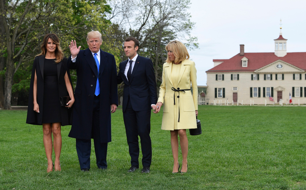 FILE - From left, first lady Melania Trump, President Donald Trump, French President Emmanuel Macron, and his wife Brigitte Macron, pose for a photo during a visit and private dinner at George Washington's Mount Vernon estate in Mount Vernon, Va., April 23, 2018. (AP Photo/Susan Walsh, file)