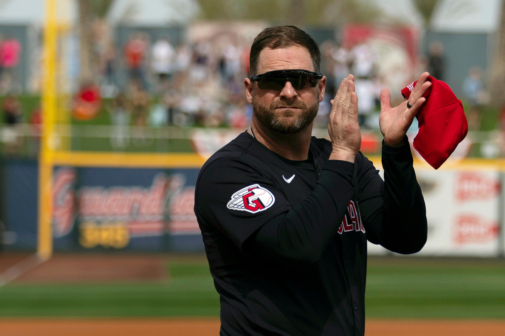 FILE - Cleveland Guardians manager Stephen Vogt turns to acknowledge veterans before the start of a spring training baseball game against the Cincinnati Reds, Feb. 24, 2024, in Goodyear, Ariz. (AP Photo/Carolyn Kaster, File)