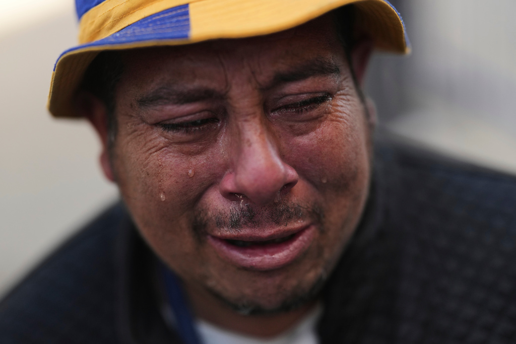 FILE - A Boca Juniors' fan cries outside outside Bombonera Stadium at the funeral of late Boca Juniors head coach Miguel Ángel Russo, who died the previous day after a long battle with cancer, in Buenos Aires, Argentina, Thursday, Oct. 9, 2025. (AP Photo/Rodrigo Abd, File)