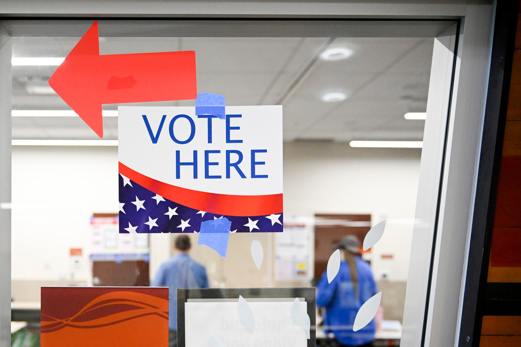 A sign hangs at a voting center during Utah's primary election on Tuesday, June 23, 2026, in Salt Lake City. (AP Photo/Alex Goodlett)