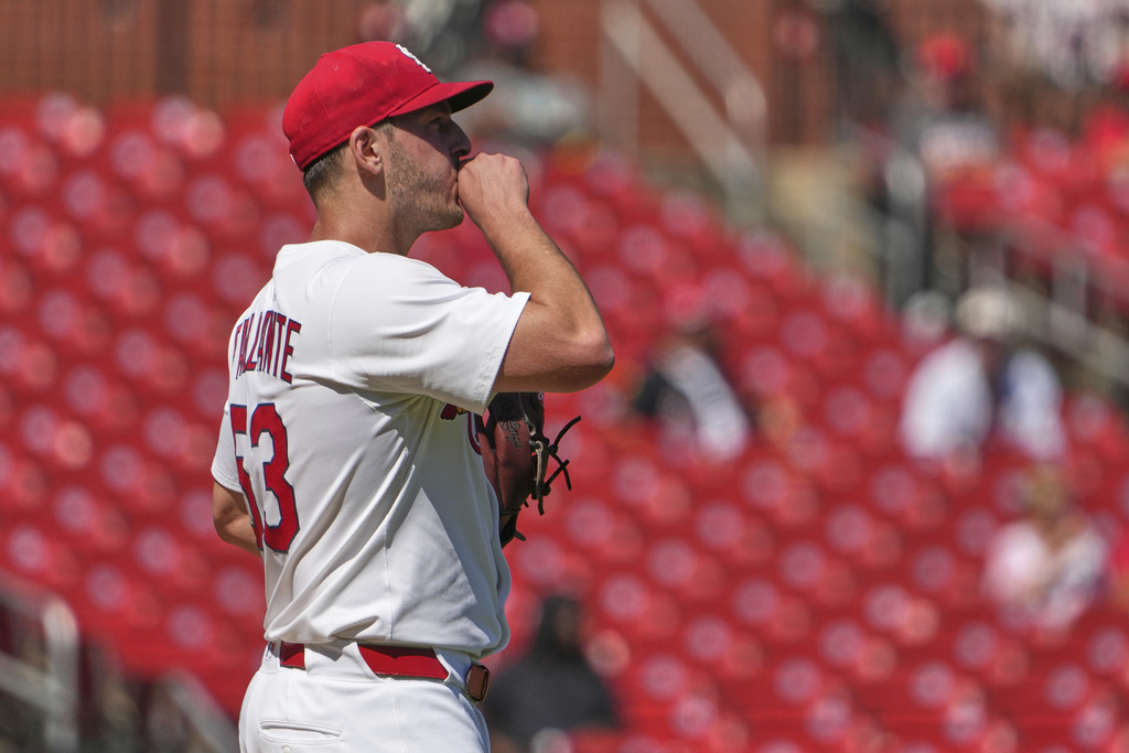 St. Louis Cardinals starting pitcher Andre Pallante blows on his hand after giving up a three-run home run to Cincinnati Reds' Spencer Steer during the fourth inning of a baseball game Wednesday, Sept. 17, 2025, in St. Louis. (AP Photo/Jeff Roberson)