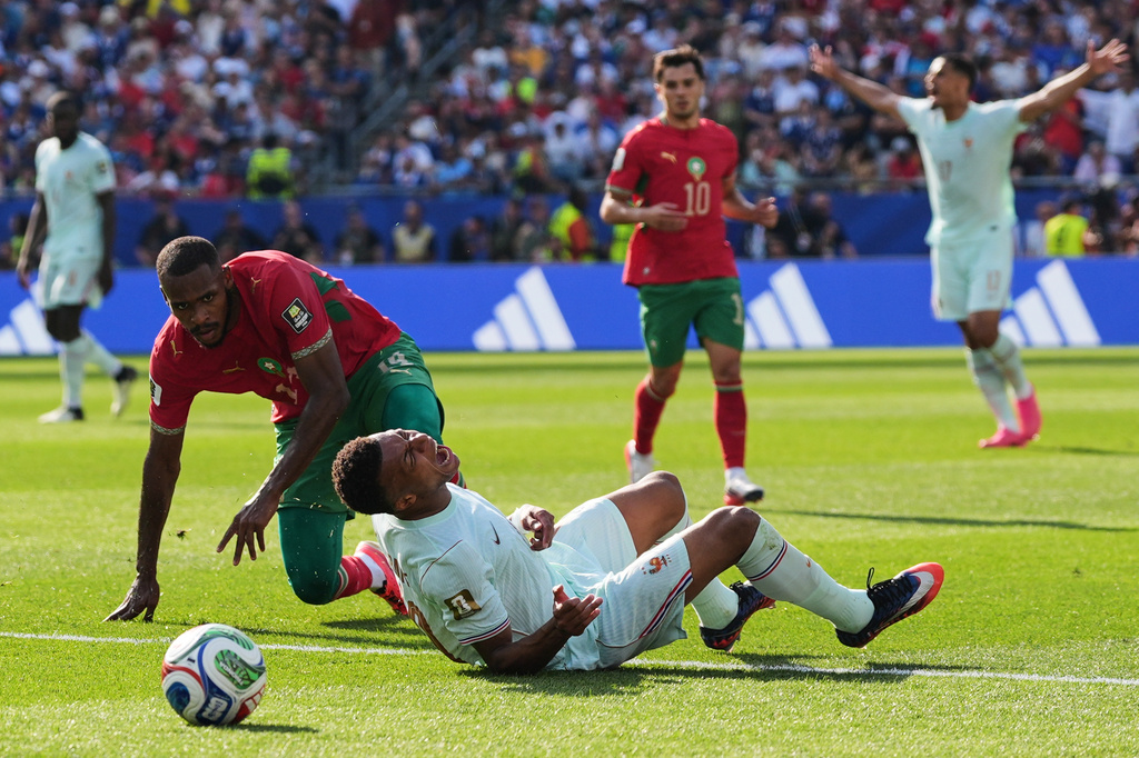 France's Kylian Mbappe (10) reacts to being tripped by Morocco's Issa Diop, left, during the World Cup quarterfinal soccer match between France and Morocco in Foxborough, Mass., near Boston, Thursday, July 9, 2026. (AP Photo/Stephanie Scarbrough)