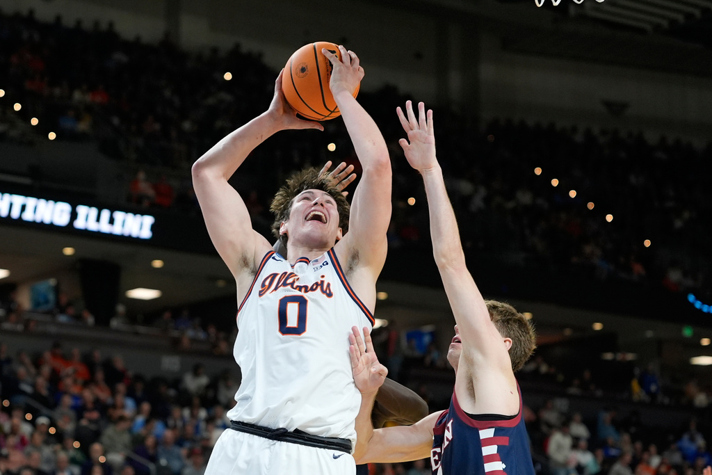 Illinois forward David Mirkovic (0) looks to pass during the first half in the first round of the NCAA college basketball tournament against Pennsylvania, Thursday, March 19, 2026, in Greenville, S.C. (AP Photo/Brynn Anderson)