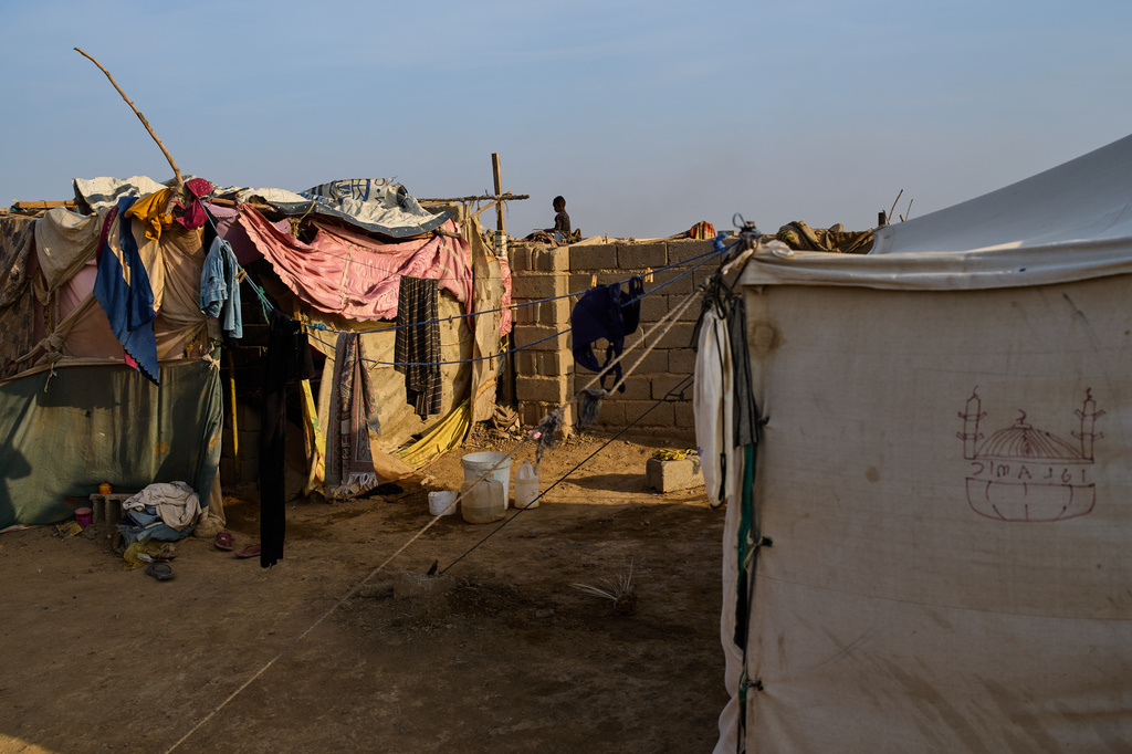 An internally displaced Sudanese child sits atop a wall at the Al Heshan camp outskirts of Port Sudan, Sudan, Wednesday, April 15, 2026. (AP Photo/Bernat Armangue)