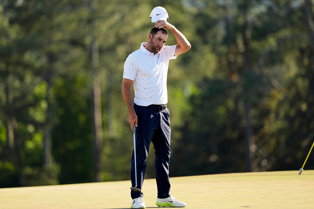 Scottie Scheffler finishes his final round of the Masters golf tournament at the Augusta National Golf Club, Sunday, April 12, 2026, in Augusta, Ga. (AP Photo/David J. Phillip)