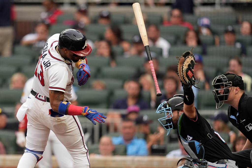 Atlanta Braves' Ronald Acuña Jr. (13) ducks a pitch by Miami Marlins pitcher Eury Pérez (39) in the second inning of a baseball game, Wednesday, Aug. 5, 2026, in Atlanta. (AP Photo/Mike Stewart)