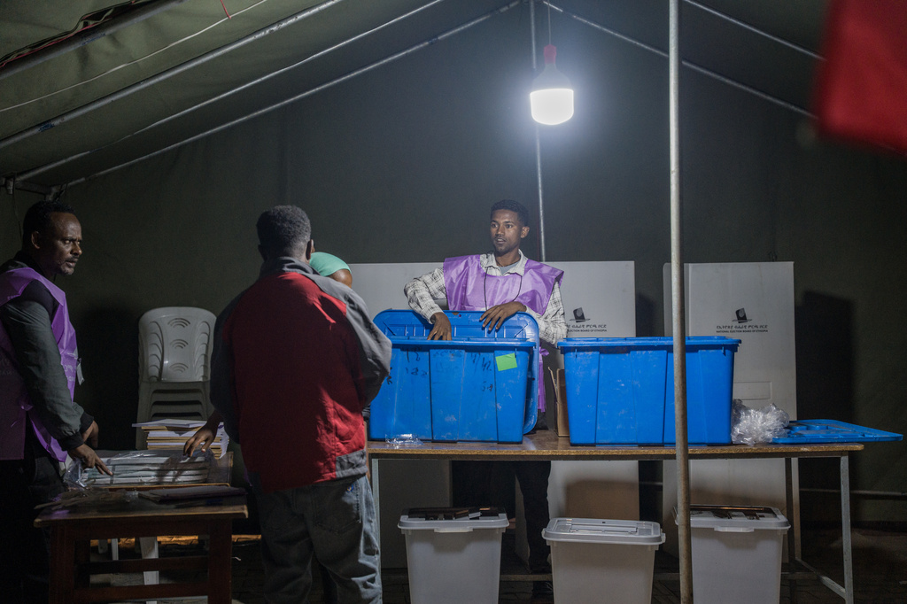 Election officials prepare a polling station before voting begins in the general election in Addis Ababa, Ethiopia, Monday, June 1, 2026. (AP Photo/Amanuel Sileshi)