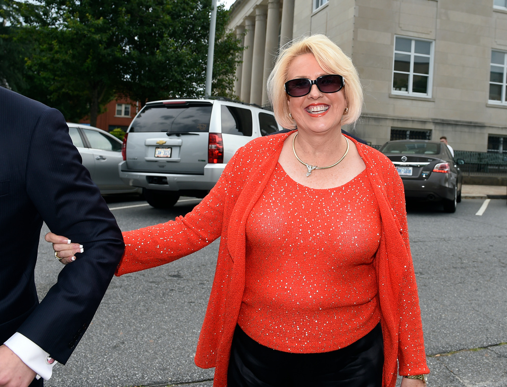 FILE - This photo taken May 19, 2017, shows Brooke Covington, a member of the Word of Faith Fellowship church in Spindle, N.C., leaving a hearing at Rutherford County Courthouse in Rutherfordton, N.C. (AP Photo/Kathy Kmonicek, File)