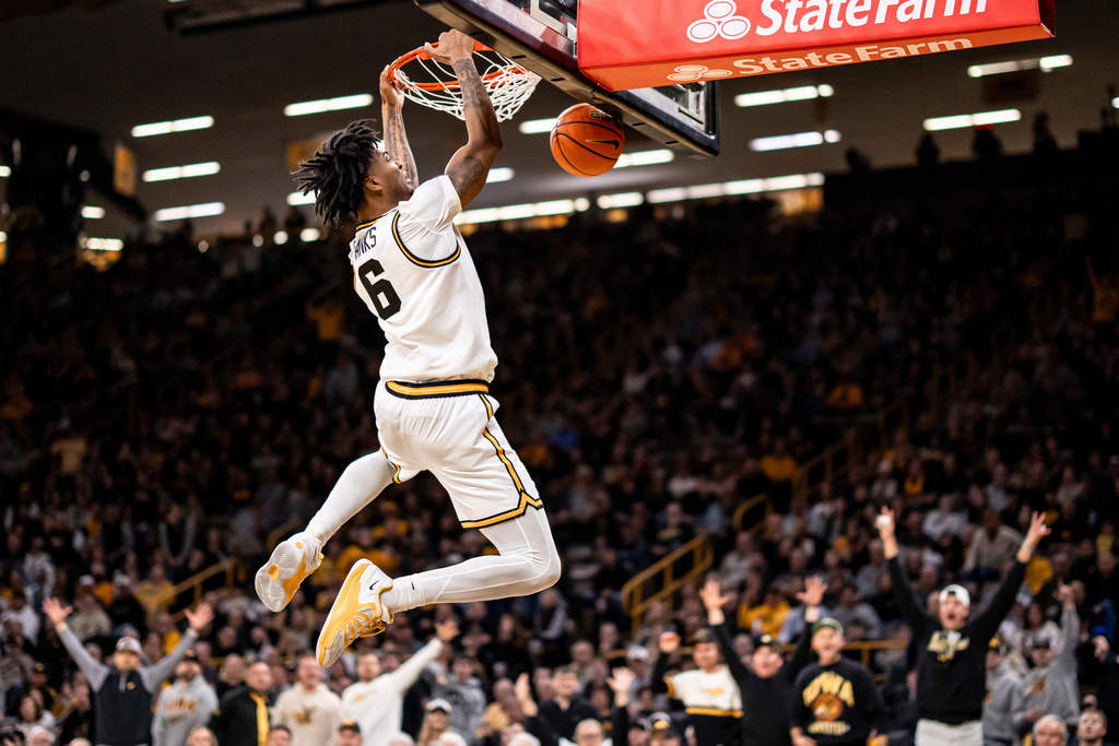 Iowa guard Tavion Banks dunks the ball during an NCAA college basketball game against USC, Wednesday, Jan. 28, 2026. (Nick Rohlman/The Gazette via AP)