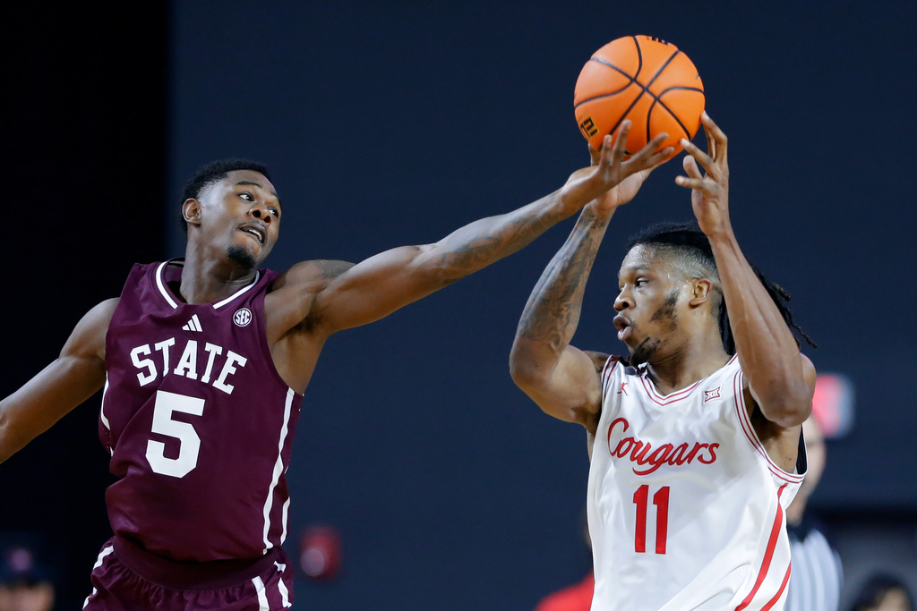 Mississippi State guard Shawn Jones Jr. (5) tips a pass away from Houston forward Joseph Tugler (11) during the first half of an NCAA college basketball exhibition game Sunday, Oct. 26, 2025, in Rosenberg, Texas. (AP Photo/Michael Wyke)