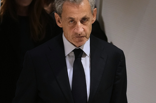 FILE- Former French President Nicolas Sarkozy leaves after a Paris court sentenced him to 5 years after finding him guilty of criminal conspiracy in an alleged scheme to finance his 2007 campaign with funds from Libya, Thursday, Sept. 25, 2025 in Paris. (AP Photo/Christophe Ena, File) FILE- Former French President Nicolas Sarkozy leaves after a Paris court sentenced him to 5 years after finding him guilty of criminal conspiracy in an alleged scheme to finance his 2007 campaign with funds from Libya, Thursday, Sept. 25, 2025 in Paris. (AP Photo/Christophe Ena, File)