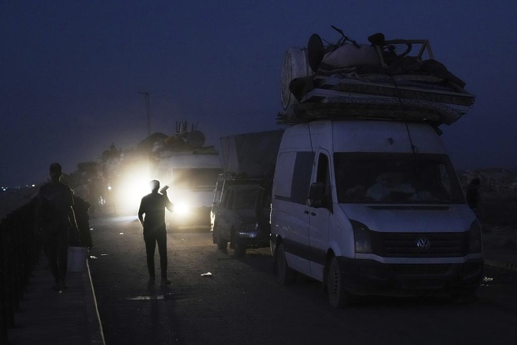 Displaced Palestinians flee northern Gaza along the coastal road toward the south, as Israel announced an expanded operation in Gaza City, Tuesday, Sept. 16, 2025. (AP Photo/Abdel Kareem Hana)