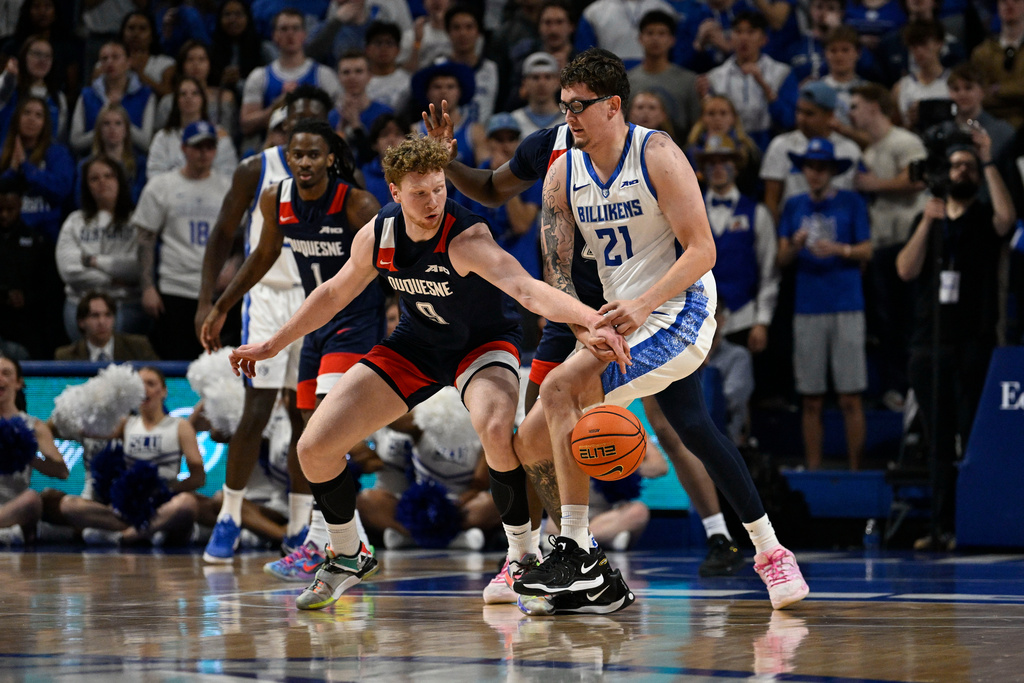 Duquesne's Jakub Necas, left, defends against the Saint Louis Billikens' Robbie Avila during the first half of an NCAA college basketball game Saturday, Feb. 28, 2026, in St. Louis. (AP Photo/Jeff Le)