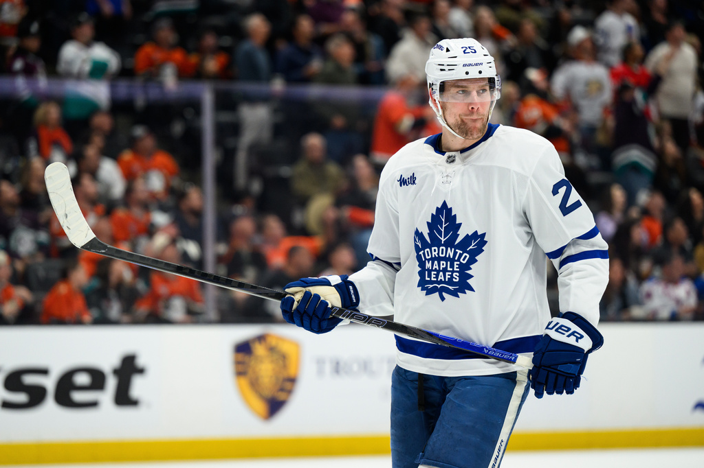 FILE - Toronto Maple Leafs defenseman Brandon Carlo looks on during the first period of an NHL hockey game against the Anaheim Ducks, March 30, 2026, in Anaheim, Calif. (AP Photo/William Liang, File)