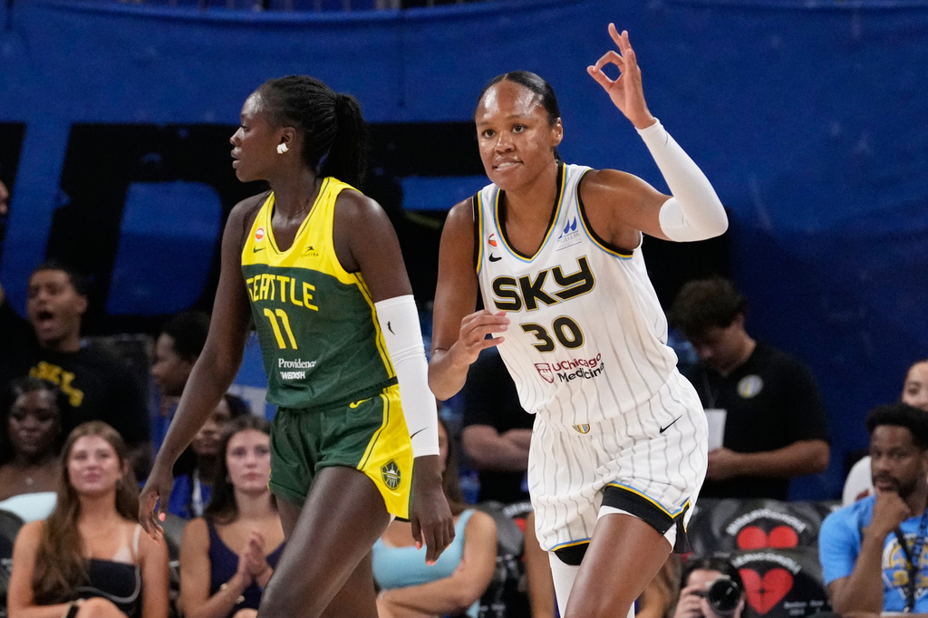 Chicago Sky forward-center Azura Stevens, right, reacts after she scored a three-point basket as Seattle Storm center Awa Fam reacts during the first half of a WNBA basketball game Wednesday, July 15, 2026, in Chicago. (AP Photo/Nam Y. Huh)