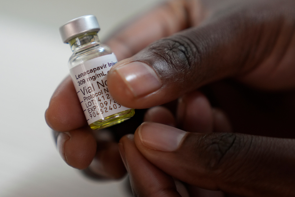 FILE - A pharmacist holds a vial of lenacapavir, at the Desmond Tutu Health Foundation's Masiphumelele Research Site, in Cape Town, South Africa, July 23, 2024. (AP Photo/Nardus Engelbrecht)