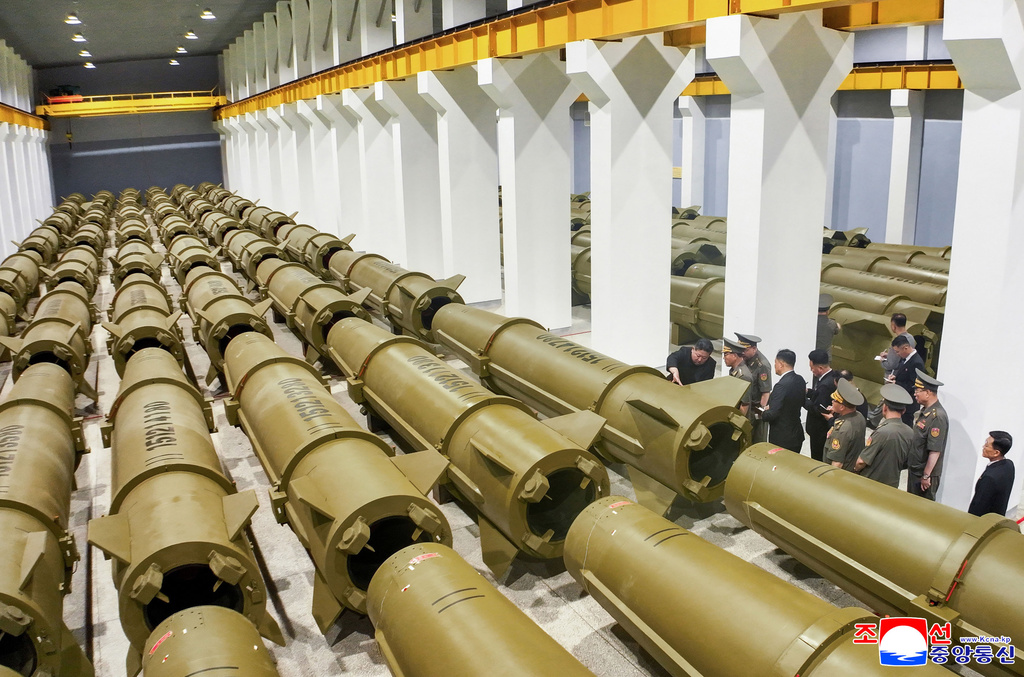 In this photo provided by the North Korean government, its leader Kim Jong Un, left, visits a weapons factory at an undisclosed place in North Korea Saturday, June 6, 2026. Independent journalists were not given access to cover the event depicted in this image distributed by the North Korean government. The content of this image is as provided and cannot be independently verified. Korean language watermark on image as provided by source reads: "KCNA" which is the abbreviation for Korean Central News Agency. (Korean Central News Agency/Korea News Service via AP)