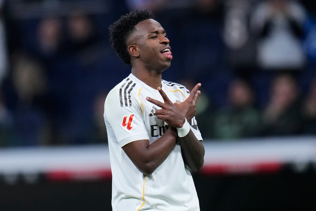 Real Madrid's Vinicius Junior celebrates scoring his side's 4th goal from the penalty spot during the Spanish La Liga soccer match between Real Madrid and Real Sociedad in Madrid, Spain, Saturday, Feb. 14, 2026. (AP Photo/Manu Fernandez)