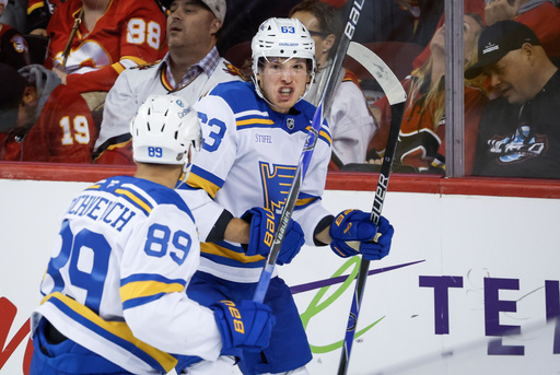 St. Louis Blues' Jake Neighbours, right, celebrates his goal with teammate Pavel Buchnevich during the third period of an NHL hockey game against the Calgary Flames in Calgary, Alberta, Saturday, Oct. 11, 2025. (Jeff McIntosh/The Canadian Press via AP) St. Louis Blues' Jake Neighbours, right, celebrates his goal with teammate Pavel Buchnevich during the third period of an NHL hockey game against the Calgary Flames in Calgary, Alberta, Saturday, Oct. 11, 2025. (Jeff McIntosh/The Canadian Press via AP)