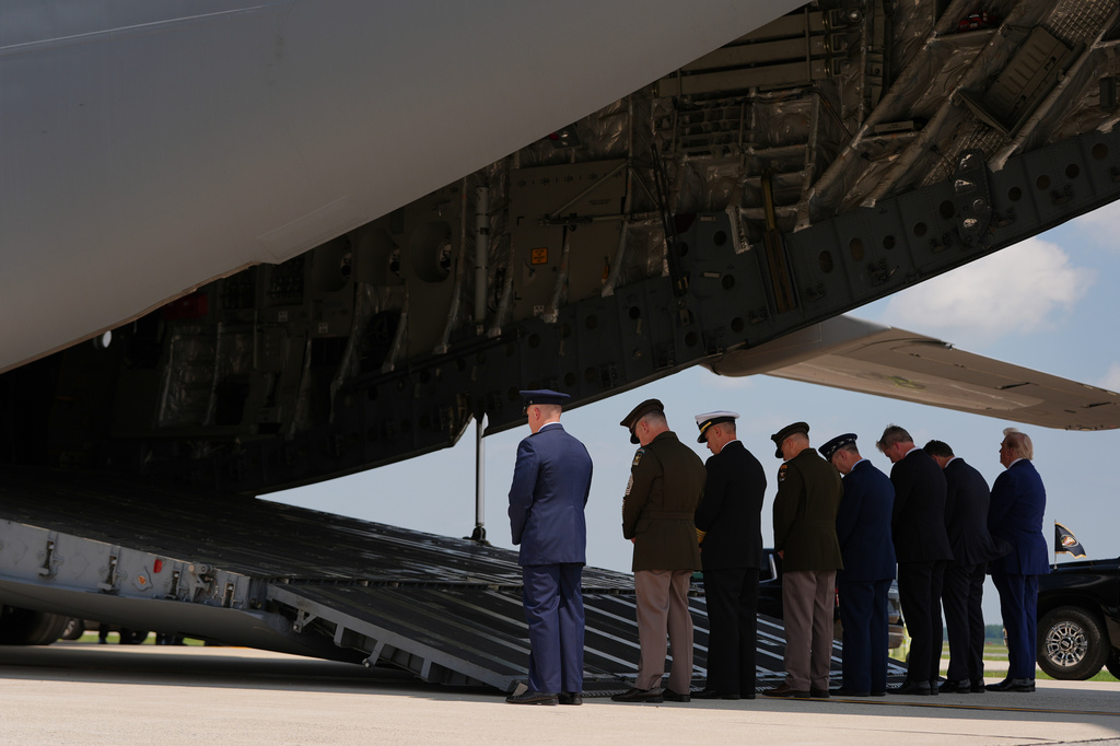 President Donald Trump, far right, and Defense Secretary Pete Hegseth, second from right, attend the dignified transfer of four U.S. service members recently killed in the Middle East, Wednesday, July 22, 2026, at Dover Air Force Base, Del. (AP Photo/Julia Demaree Nikhinson)