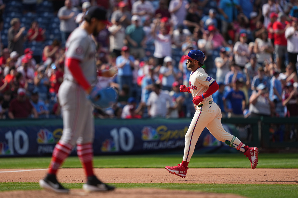 Philadelphia Phillies' Bryce Harper runs the basses after hitting a home run off of Philadelphia Phillies' Seth Johnson during the eighth inning of a baseball game, Wednesday, April 1, 2026, in Philadelphia. (AP Photo/Matt Rourke)