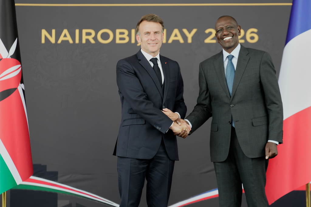French President Emmanuel Macron, left, and Kenyan President William Ruto shake hands at State House in Nairobi, Kenya, Sunday, May 10, 2026. (AP Photo/Brian Inganga)