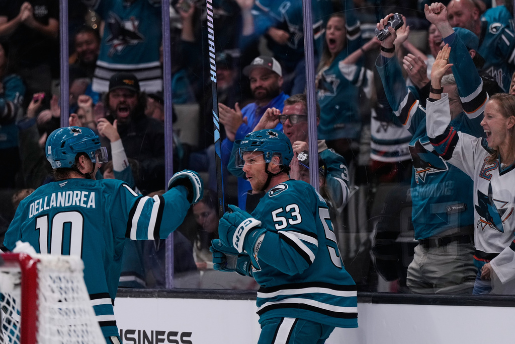 San Jose Sharks left wing Jeff Skinner (53) celebrates with center Ty Dellandrea (10) after scoring a goal during the first period of an NHL hockey game against the Vegas Golden Knights, Thursday, Oct. 9, 2025, in San Jose, Calif. (AP Photo/Godofredo A. Vásquez)