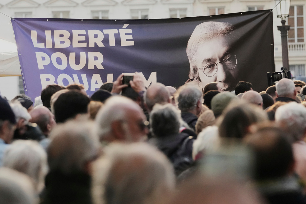 File - A placard reading ''Freedom for Boualem Sansal'' is seen during a gathering in support of detained Franco-Algerian author Boualem Sansal, in Paris, Tuesday, March 25, 2025. (AP Photo/Thibault Camus, File)