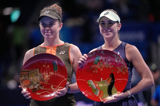Switzerland's Belinda Bencic, right, and Czech Republic's Linda Noskova, left, pose with their trophies after the Pan Pacific Open women's tennis tournament at Ariake Coliseum, in Tokyo, Sunday, Oct. 26, 2025. (AP Photo/Louise Delmotte) Switzerland's Belinda Bencic, right, and Czech Republic's Linda Noskova, left, pose with their trophies after the Pan Pacific Open women's tennis tournament at Ariake Coliseum, in Tokyo, Sunday, Oct. 26, 2025. (AP Photo/Louise Delmotte)
