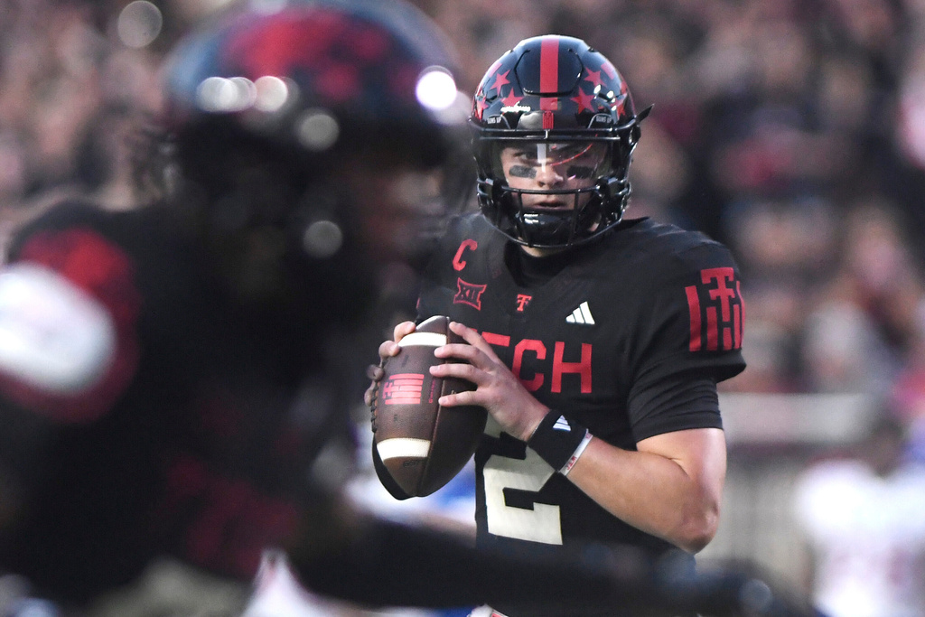 Texas Tech quarterback Behren Morton (2) looks to throw the ball during the second quarter of an NCAA college football game against Kansas, Saturday, Oct. 11, 2025, in Lubbock, Texas. (AP Photo/Annie Rice)