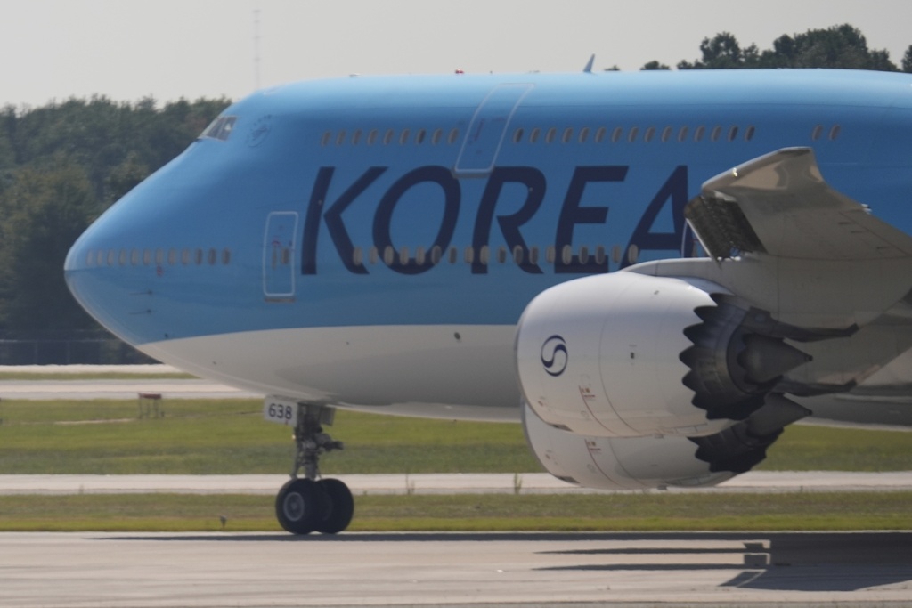 A Korean Air charter plane carrying Korean workers detained in immigration raid at Georgia factory leaves Hartsfield-Jackson International Airport in Atlanta bound for South Korea, Thursday, Sept. 11, 2025. (AP Photo/George Walker IV)