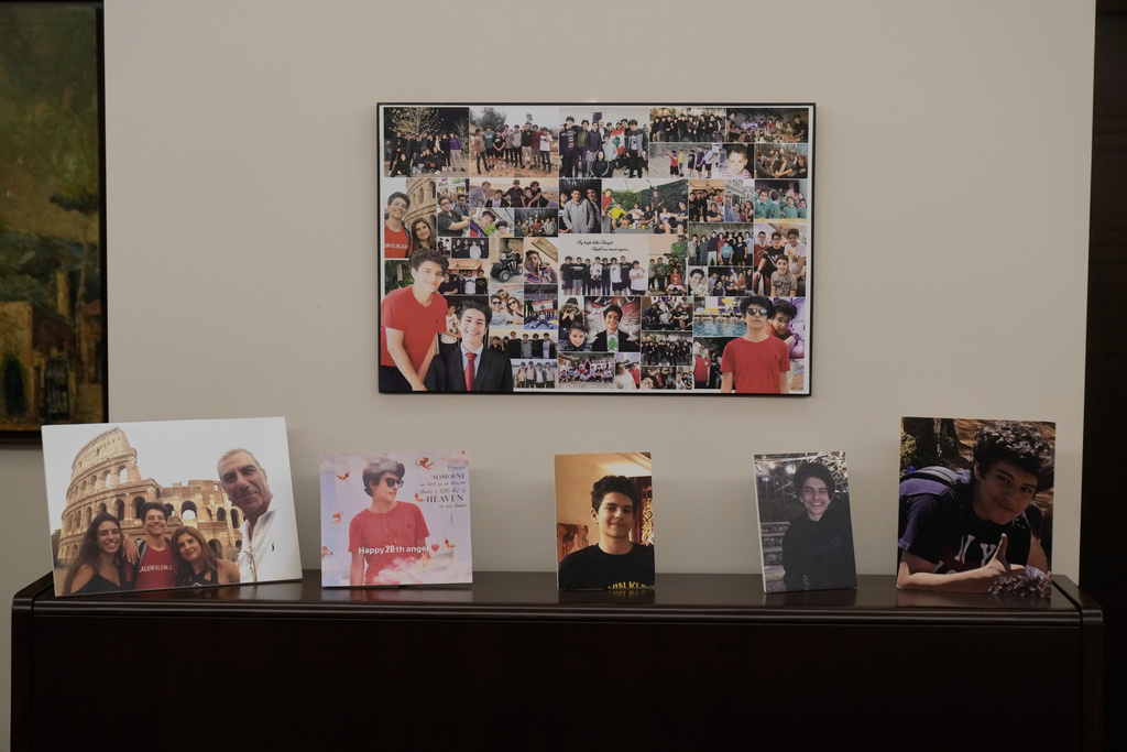 Pictures of Elias, who was killed in the 2020 Beirut port explosion, decorate a wall in the home of his mother, Mireille Khoury, in Beirut, Lebanon, Nov. 14, 2025. (AP Photo/Bilal Hussein)