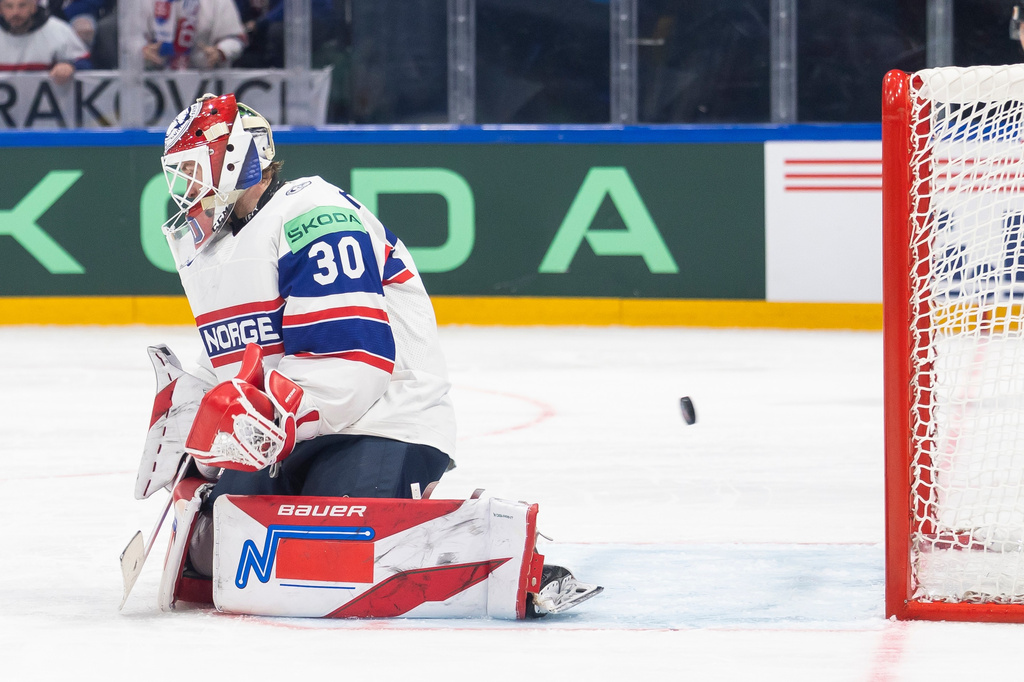 Norway's goaltender Tobias Normann, concedes a goal during the 2026 IIHF Men's Ice Hockey World Championship preliminary round group B game between Slovakia and Norway, in Fribourg, Switzerland, Saturday, May 16, 2026. (Cyril Zingaro/Keystone via AP)